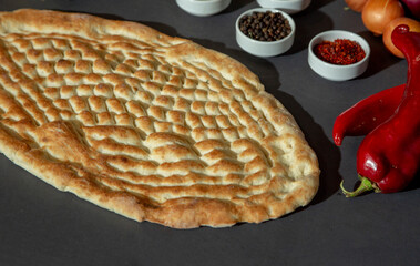 Ramadan Pide - Turkish popular bread for Ramadan month on a gray background. Cop cpase and top view. stock photo stock photo
Abundance, Backgrounds, Baked, Baking, Bread