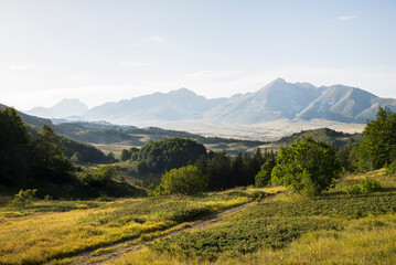 Landscape, view of the Gran Sasso plateau during sunset. Green valley and mountain peaks