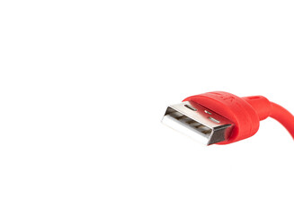 Close-up of a usb connector on a red cable on a white background.