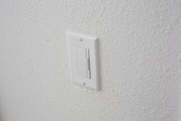 A view of a light dimming switch.