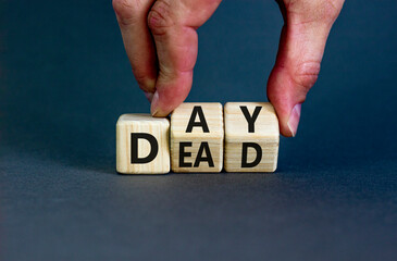 Day of the dead symbol. Concept words Day of the dead. Man hand. Beautiful grey table grey background. Day of the dead concept. Copy space.