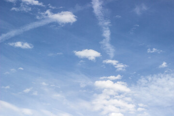 Beautiful sky with white clouds background. Light cumulus clouds in the blue sky