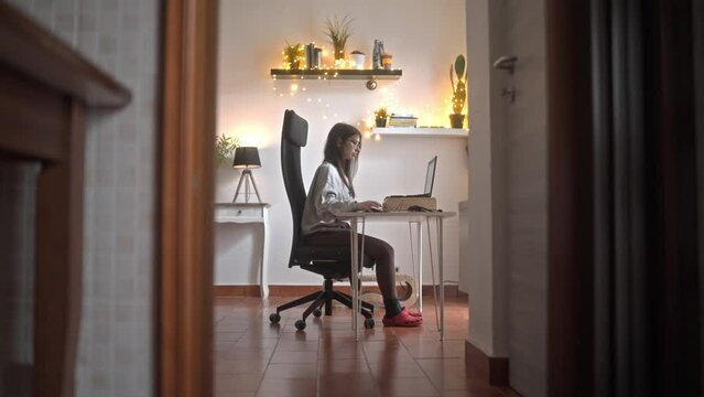 Caucasian girl working from home with correct ergonomy