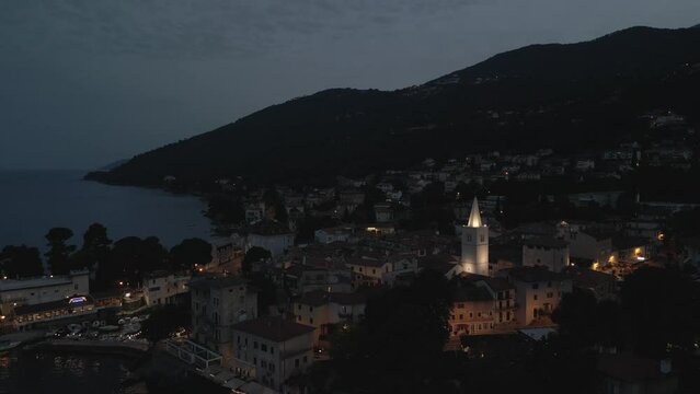 Aerial shot of St. George's Church and the town of Lovran at dusk, Lovran, Eastern Istria