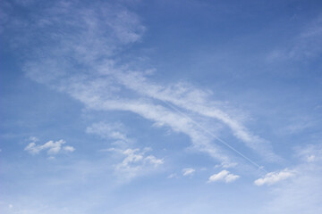 Beautiful sky with white clouds background. Light cumulus clouds in the blue sky