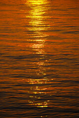 Background of the reflection of the sun on the surface of sea water.
