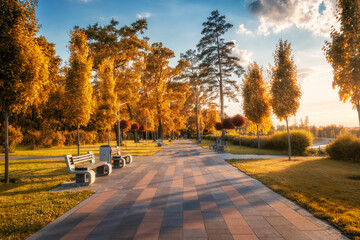 Beautiful park in Bucha, Ukraine before war in autumn. Colorful landscape with orange trees,...