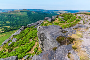 A view of rock strata along the top of Bamford Edge, UK in summertime