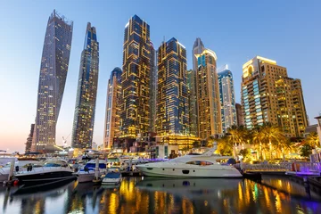 Wandaufkleber Dubai Marina skyline yacht harbor architecture travel at night twilight in United Arab Emirates © Markus Mainka