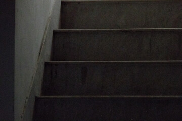 black and white photo of an empty staircase made of marble stone. horizontal lines make great abstract photo. © suparna