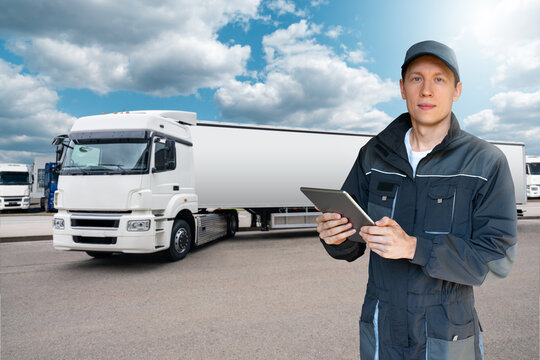 Manager With A Digital Tablet On The Background Of Truck. Fleet Management	