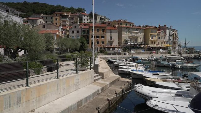 Boats in the harbour and restaurants and bars lining the sea front, Moscenicka Draga, Kvarner Bay
