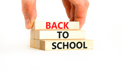 Back to school and support symbol. Concept words Back to school on wooden blocks. Businessman hand....