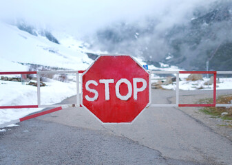 Red stop sign in the mountains