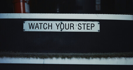 Watch your step school bus advertisement sign children attentiveness safety. © stockbusters