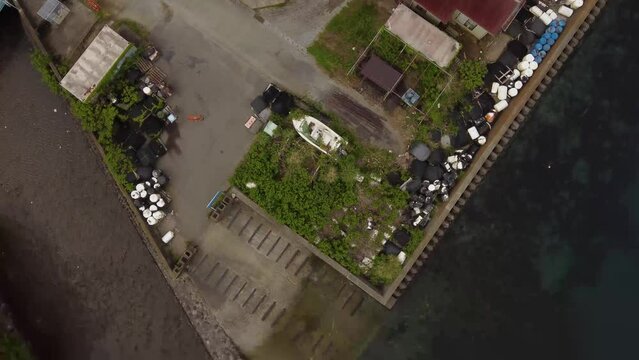 Aerial view of a boat on the grass near the sea in Numazu, Japan