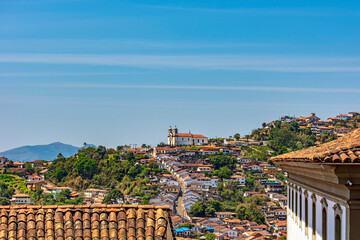 View of the houses, roofs, hills and churches of the historic city of Ouro Preto in Minas Gerais,...