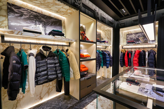 SINGAPORE - JANUARY 21, 2020: clothes on display at Moncler store in Singapore Changi Airport. Moncler S.p.A is an apparel brand mostly known for its skiwear.