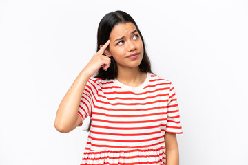Young Colombian woman isolated on white background making the gesture of madness putting finger on the head