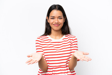 Young Colombian woman isolated on white background having doubts