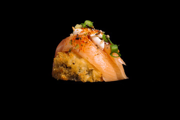 brazilian japanese food isolated on black background nigiri salmon and farofa.