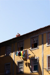 Clothes on clothesline outside building
