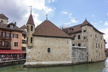 Medieval insular Palais de l'Isle (Isle Palace) in Annecy, which date from the 12th century. Isle Palace look like a stone ship. Annecy, Haute-Savoie department, Auvergne-Rhone-Alpes region, France.