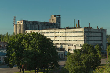 A factory building bakery in an industrial zone in port by summer day