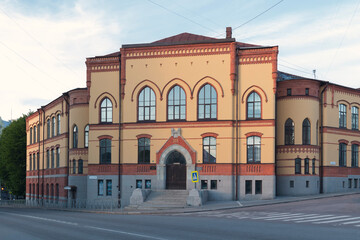 Fototapeta na wymiar A building on a street of Vyborg by summer day