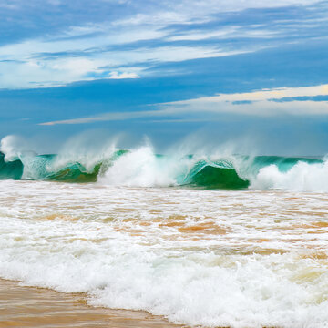Tropical beach with high waves