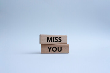 Miss you. Concept word Miss you on wooden cubes. Beautiful white background. Business and Miss you concept. Copy space.