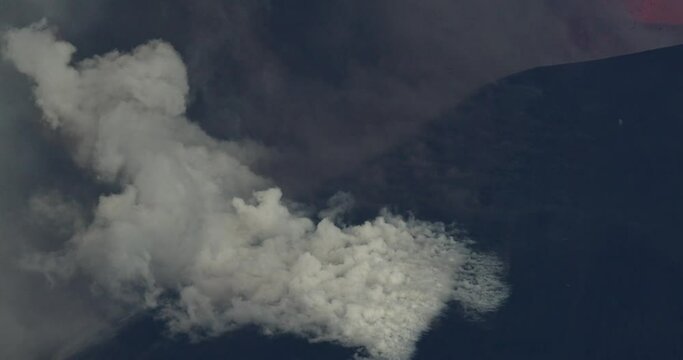 Emission of gas and ash typical of an active volcano like Etna