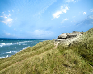 World War II German bunkers dotting the beaches of Hirtshals on the coast of Skagerrak, Jutland,...