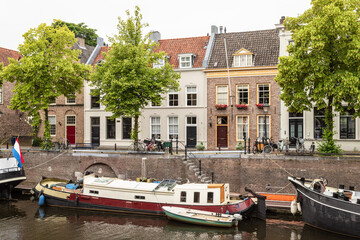 Old harbor in Den Bosch, with boats and medieval houses.