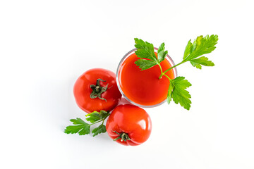 Diet tomato juice with parsley on white background. Vegan vegetable smoothie.
