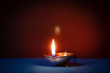 Title	Happy Diwali. Traditional symbols of Indian festival of light. Burning diya oil lamps and...