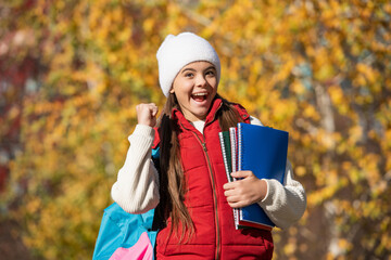 successful teen girl back to school in autumn