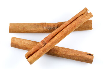 Fragrant cinnamon sticks isolated on white background. Top view.