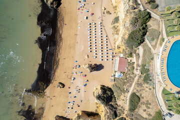 Aerial view of amazing beach with white umbrellas and turquoise sea at sunset. Mediterranean sea, .