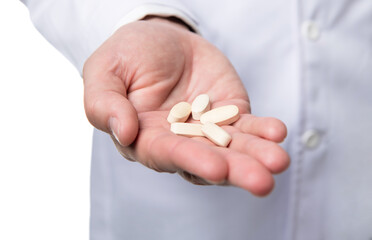 pills and medications. hands hold medication. vitamin pills closeup