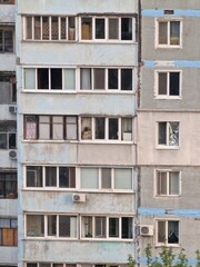 Fototapeta na wymiar fragment of a multi-storey building of Soviet architecture