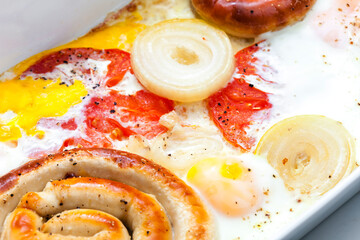 wine sausage,sauge and tomatoes with onion baked with eggs
