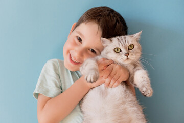 Child and cat on blue background