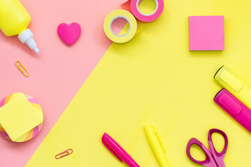 School and office supplies on a yellow-pink background