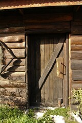 Old wooden cottage used as a storage place