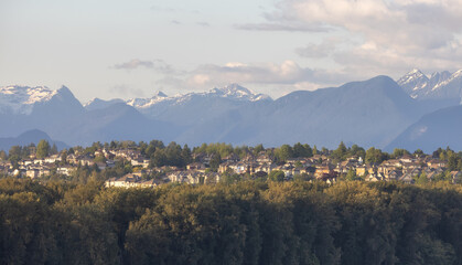 Residential Homes in a modern city with mountain peaks in background. Mary Hill, Port Coquitlam,...