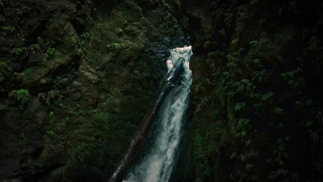 Salto do Cagarrao Waterfall. Epic waterfall hidden on Prego river. Sao Miguel Island, Azores, Portugal