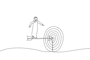 Cartoon of arab businessman standing on the arrow hit the target. the business concept of accuracy and purpose. Single continuous line art style