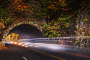 Traffic passing through a tunnel in the Smoky Mountains at autumn