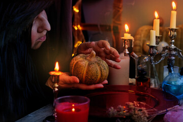 red dish with water, candle lights in dark room of fortuneteller, esoteric Oracle, psychic throws...